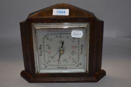 An Edwardian Smiths Shortland barometer having oak case with metal dial