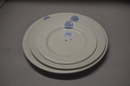 Three graded plates,'Royal Lancashire agricultural society' emblem to tops in blue on white ground.