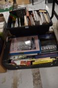 Two crates of books of varied genres including baking, gardening, psychology, dictionaries and a