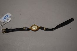 An early 20th century Chalet ladies wristwatch with a yellow metal case