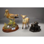 Three figure studies including a Beswick deer, a Prestige collection Common Snipe and Labrador