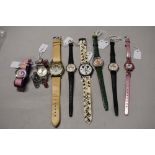 Eight ladies/girls fashion watches including Mickey mouse and teddy bear.