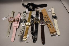 Ten ladies watches, various brands including Playboy, Armani, Oasis and more.