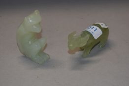 Two pale jade type stone carved figures of an Ox and a Monkey