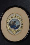 A Harwood, (19th/20th century), a watercolour, travelling musicians, oval, crested, 11 x 9cm,