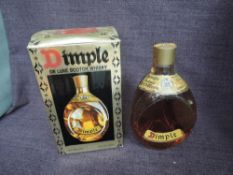 A bottle of Haig & Co Dimple Deluxe Scotch Whisky, 70% proof, 26 2/3 fl oz, in original box