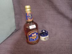 A bottle of Pusser's Navy Rum, 54.5% vol (109 proof), 70cl along with a miniature Flagan of Pusser's