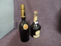 A bottle of Benedictine D.O.M, 43% no capacity stated and a bottle of Sandeman's Sherry no