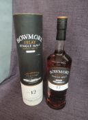 A bottle of Bowmore 12 Year Old Islay Single Malt Scotch Whisky, Enigma, 40% vol, 1 litre in card