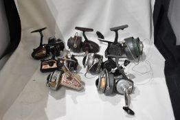 A selection of spinning reels including Youngs, Shakespeare and Mitchell