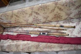 A Zeus 919330 Spin master 12ft by Abu Garcia and 2 unmarked vintage spinning rods