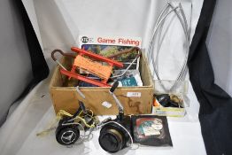 A small box of mixed vintage fishing tackle including hooks, weights and two spinning reels one