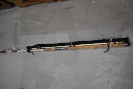 A vintage fiberglass beachcaster rod and a Steade fast spinning rod