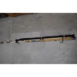 A vintage fiberglass beachcaster rod and a Steade fast spinning rod