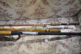 A vintage Bamboo 2pc beach caster type rod, a Milbro gem fiberglass fly rod in poor condition and