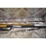 A vintage Bamboo 2pc beach caster type rod, a Milbro gem fiberglass fly rod in poor condition and