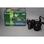 A Fujifilm Finepix S602 zoom digital camera with Super EBC Fujinon zoom lens in original box