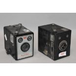 Two box cameras. A Kodak Brownie Model 1 amnd a Kodak six-20 Popular brownie