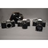 Three Praktica cameras. A Praktica LLC camera with Meyer-Optik Gorlitz Oreston 1,8/50 lens. A