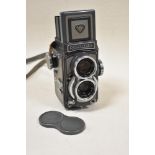 A Rolleiflex Baby Grey reflex camera with Schneider- Kreuznach Xenar 1:3,5/60 and 1:2,8/60 lens