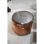 An antique copper cheese kettle with lid and wrought iron handle