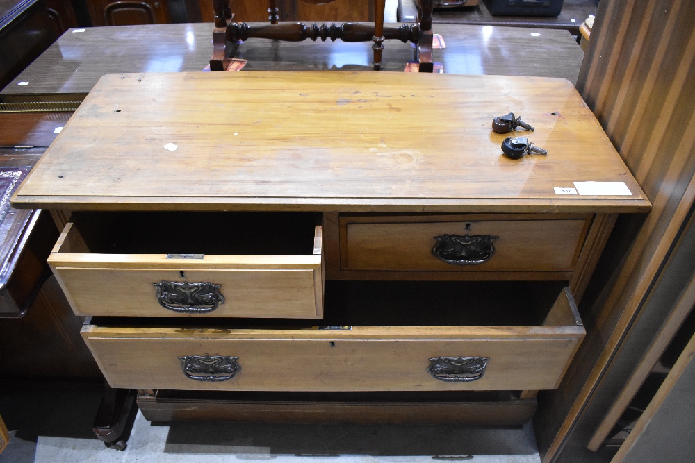 An Edwardian walnut chest of drawers, having two short and two long drawers, each with embossed - Image 2 of 2