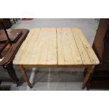 A farm house style pine utility table with plank top. 75cm H x 115cm W x 115cm D