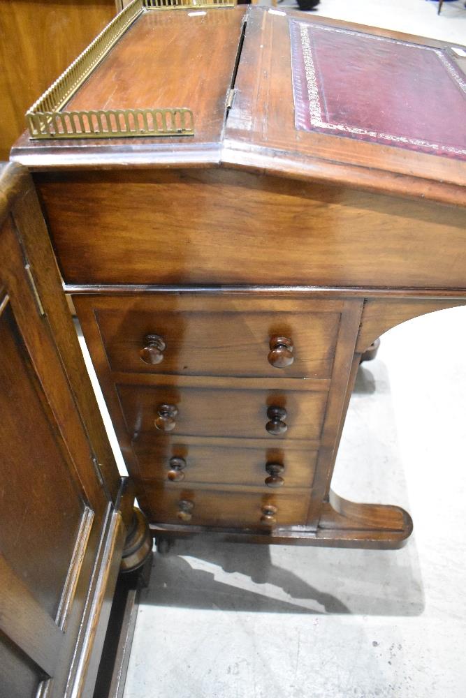 A late 19th century walnut Davenport, having brass three quarter gallery, stained leather skiver and - Image 4 of 4