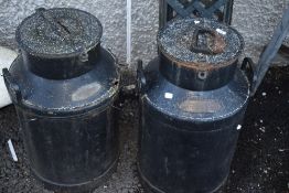 A pair of vintage cast churns, labelled Smith & Sons, Ozendyke Manor