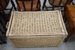 A vintage wicker laundry or similar basket