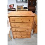 A modern Pine chest of five drawers, also having a fitted safe with key into one drawer.