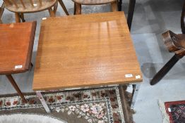 A mid century coffee table having a chrome frame 57cm x 57cm