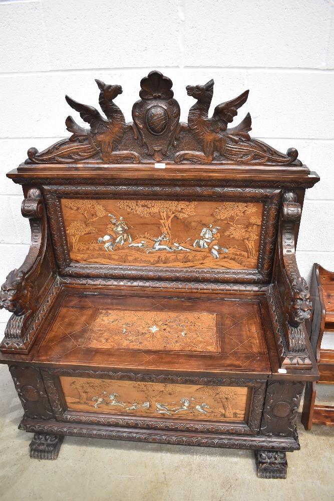 A mid to late 19th Century Northern Italian (lombardy) carved fruitwood and marquetry inlaid