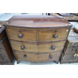 A Victorian bow fronted chest of two over two drawers with cock beaded draw fronts and original