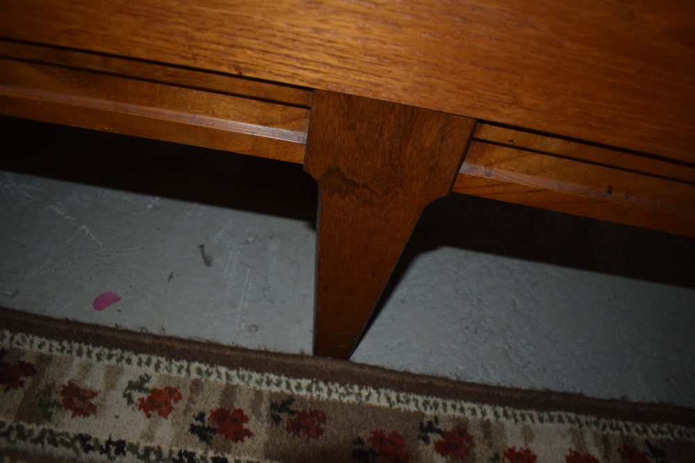 A mid century Teak long boy side board having three drawers and double cupboards in need of - Bild 2 aus 2