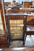 An early 20th century display case having a leaded light door on mahogany frame. 60cm W x 127cm H