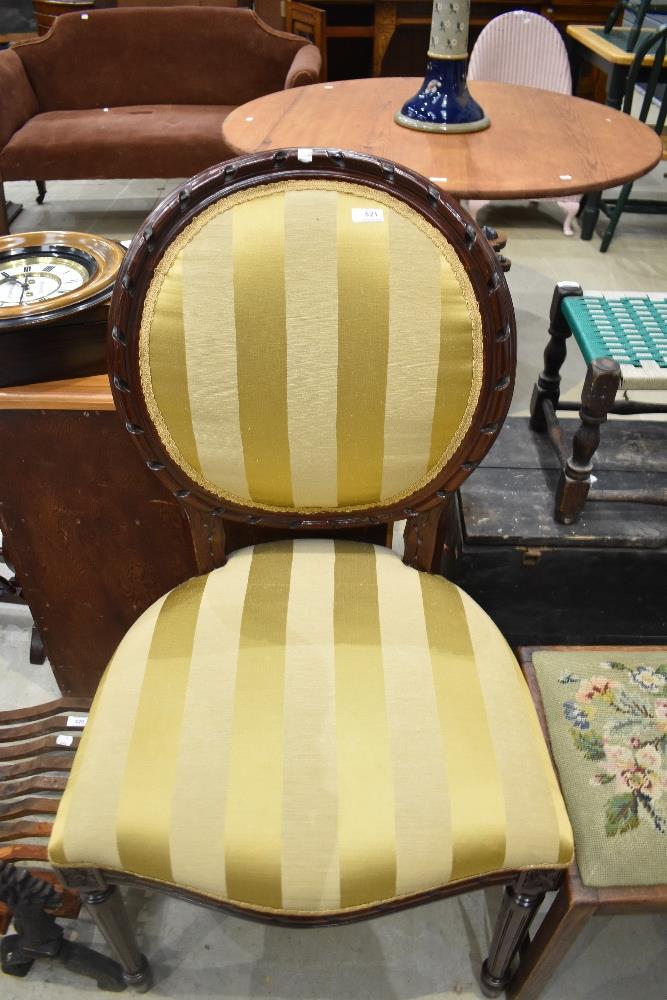 A reproduction regency upholstered dining chair