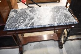 A Victorian console table on carved feet with Mahogany frame under drawers and faux marble painted