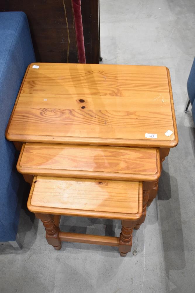 A nest of three modern pine occasional tables, largest 48cm x 54cm