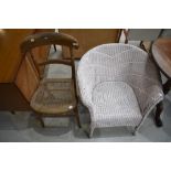 A Beech wood framed utility chair with Bergere seat and a Lloyd Loom style tub chair.