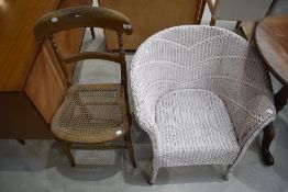 A Beech wood framed utility chair with Bergere seat and a Lloyd Loom style tub chair.