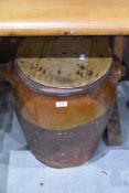 A large salt glazed crock having wooden lid, height approx. 50cm