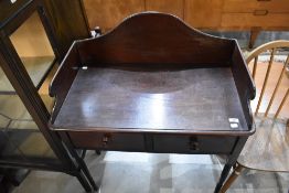 A late Victorian wash stand having double drawers and turned feet on Mahogany frame. 80cm W x