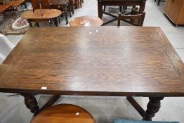 An Old Charm style extending dining table having Oak frame on turned legs. 160cm long or 240cm