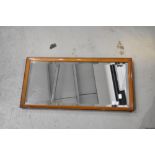 A vintage wall mirror, labelled 'Sadlers' , approx. 69 x 35cm