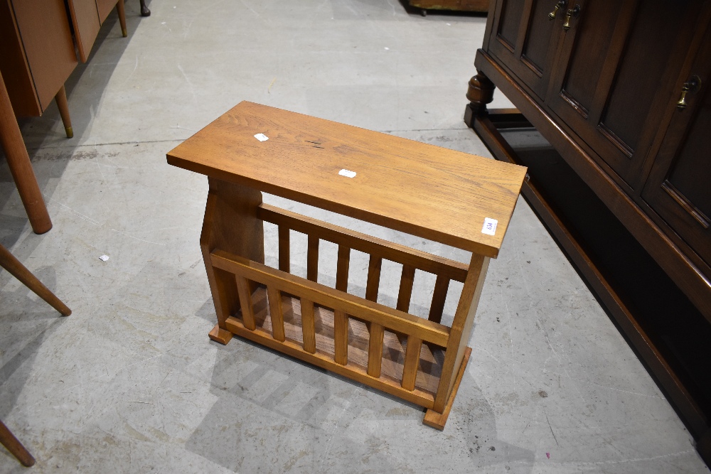 A 20th century light oak magazine rack, with slatted sides