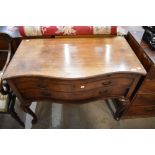 A Victorian bachelor desk having two under drawers with pull out desk top having serpentine front on