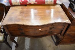 A Victorian bachelor desk having two under drawers with pull out desk top having serpentine front on