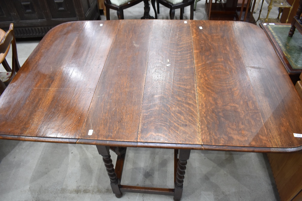 An early 20th Century oak twist gateleg table