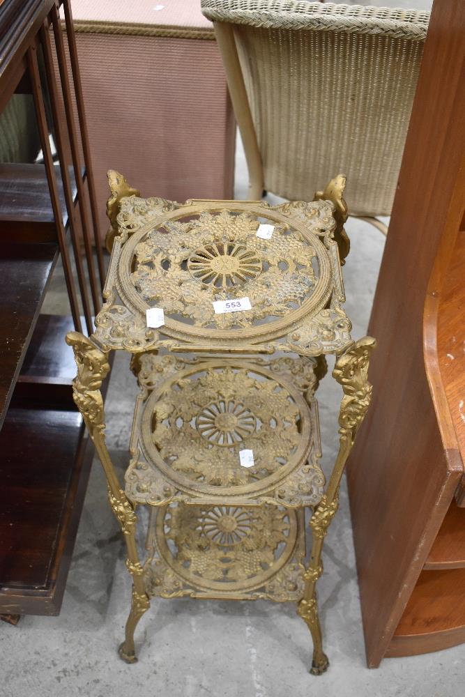 A Victorian style cast brass three tier plant stand